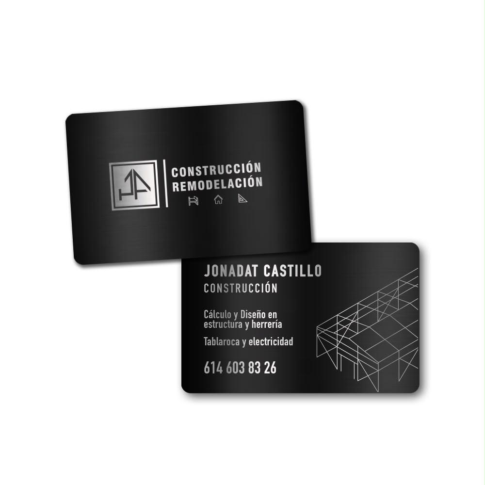 Tarjetas metálicas negras Jonadat Castillo Construcción y Remodelación con logo JA y datos de contacto